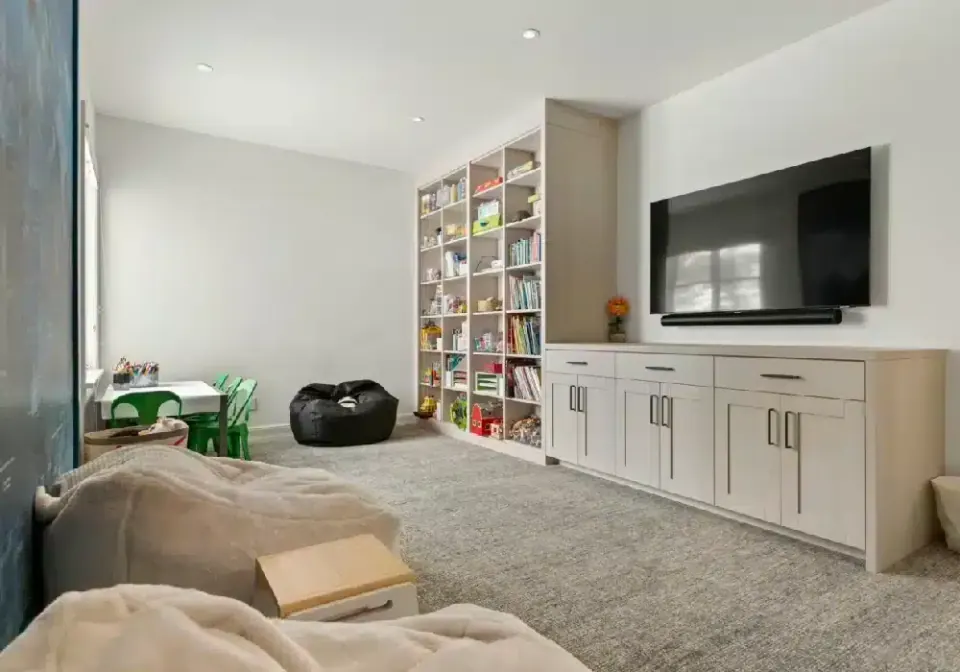 Family room with built-in shelving and media wall