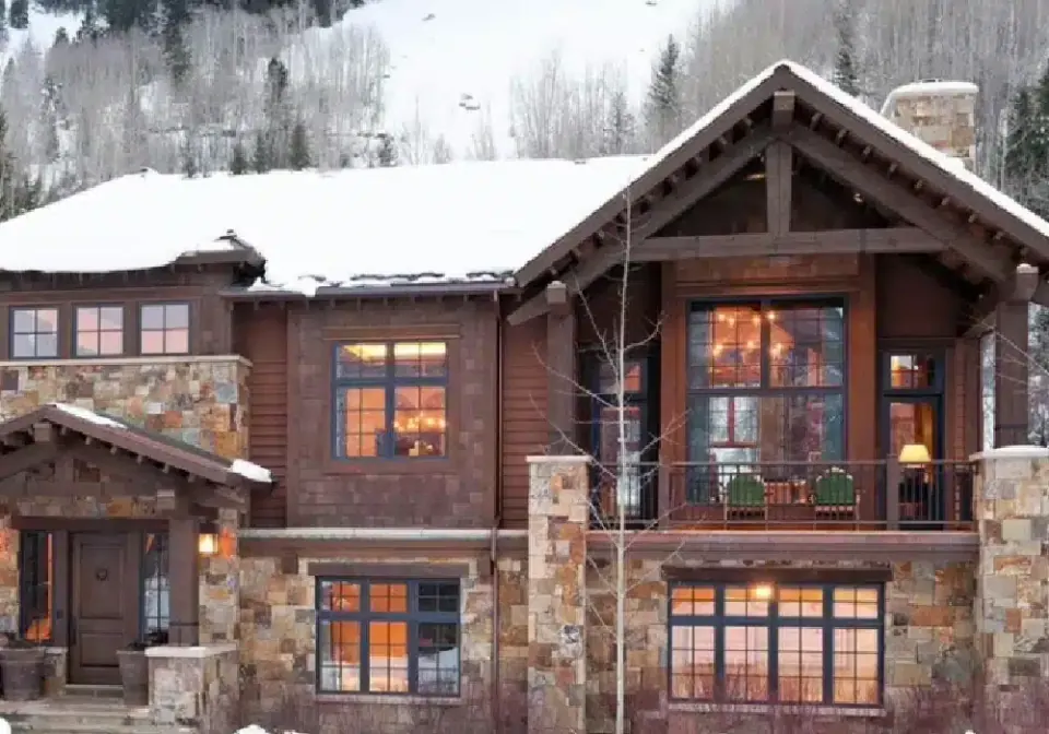 Stone and timber custom home in winter